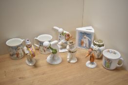 A group of nine Royal Doulton The Snowman figures and giftware, comprising Savings Book, handled