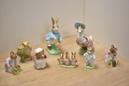 A group of eight Royal Doulton/Beswick Pottery Beatrix Potter figures and figurines, comprising