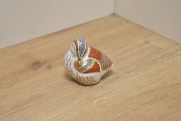 A Royal Crown Derby bone china Teal Duckling paperweight, decorated in a stylised Imari design