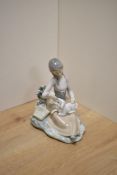 A Lladro Porcelain figurine Little Bo Peep, girl feeding lamb, printed and impressed marks to base