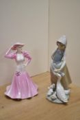 A Lladro porcelain figurine 'Snails For The Ducks' 24cm sold along with a Coalport bone china