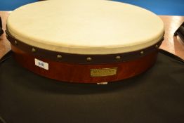 A traditional Bodhran , with beater and case