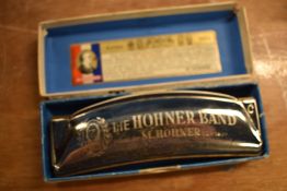 A vintage boxed Hohner Band harmonica