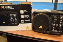 A Behringer Eurolive 150 Watt compact monitor system, with box, powers up and sound through each
