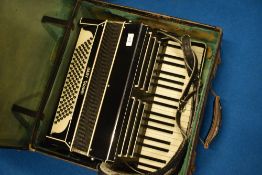 A vintage Baby Grand piano accordion, with case