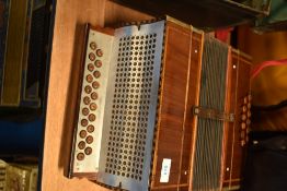 A vintage wooden cased button accordion , sold with later accordion case (German)
