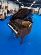 A modern opus baby grand piano