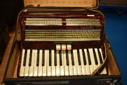 A vintage Worldmaster Piano accordion, with case
