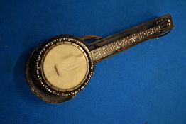 A six string banjo , stamped to body , Will Birch, Accrington, having mother of pearl inlays to