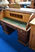 A 19th Century oak roll top desk, width approx. 136cm