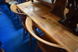 A vintage pine kitchen table and four chairs