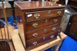 A 19th Century George III mahogany dwarf chest of four long drawers, having brass handles and