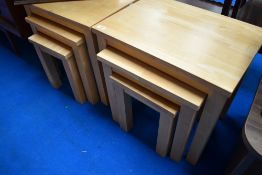 Two modern beech effect nests of three tables