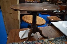 A 19th Century mahogany pedestal table having circular top on turned column and triple splay legs,