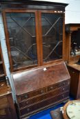 An early 20th century mahogany bureau bookcase, having astral glazed display section