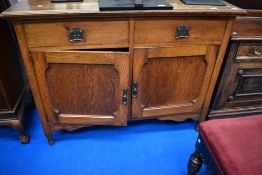 A late Victorian oak mirror back sideboard having Art Nouveau style drawer handles, dimensions