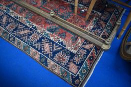 A traditional eastern rug having geometric patttern, approx. 183 x 118cm