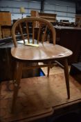 A vintage Ercol chair having low back