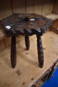 A rustic carved stool