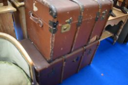 Two large vintage travel trunks