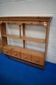 A natural pine kitchen wall shelf with four drawers. Width approx. 109cm