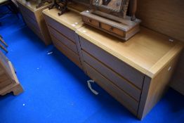 Three sets of golden oak effect low drawers, by Hulsta