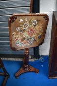A Victorian mahogany pole screen