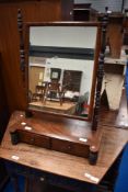 A Victorian mahogany toilet mirror with twin drawers to base