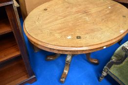 A 19th Century loo table of oval form with quarter veneered top having inlaid foliate decoration