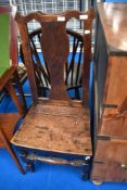 A 19th Century oak solid seat chair having vase back