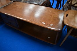 An Ercol dark stain coffee table, in the Pandora style with drawer storage under, approx. 125 x