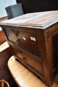 An early 20th Century oak two drawer low chest