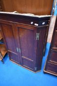 A 19th Century oak corner cupboard