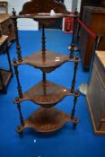 A 19th Century walnut corner whatnot having inlaid decoration, height approx. 140cm