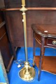 A traditional brass standard lamp