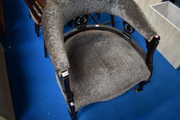 A Victorian mahogany framed tub chair with later upholstery