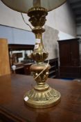 A vintage gilt work table lamp
