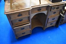 A Victorian stripped pine kneehole desk or dressing table, width approx. 113cm