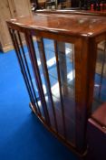 A mid 20th Century walnut china cabinet
