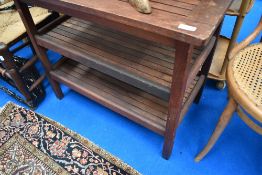 A teak garden three tier side table, approx. 82 x 51cm, having HMS Enchantress plaque, having been