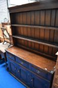 A reproduction oak dresser of nice quality in a period style, width approx. 137cm