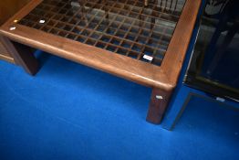An interesting coffee table having wood grid frame and glass top, approx. 90 x 90cm