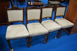 A set of four Victorian upholstered dining chairs