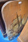A rustic firescreen having galleon decoration