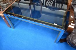A chrome and smoked glass coffee table approx. 91 x 91cm