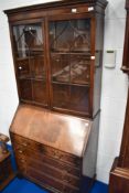 A reproduction mahogany bureau bookcase