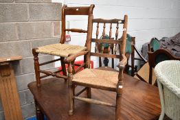 A 19th Century childs carver chair having spindle back and rush seat and a similar period kitchen