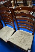 A pair of traditional ladderback kitchen chairs