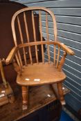 A traditional Childrens Windsor style rocking chair