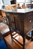 An oak side cabinet in the Priory style